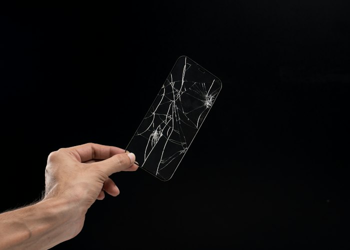 Damaged phone display removed for replacement